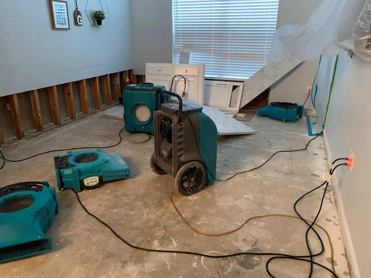 Dehumidifier in flood-cut room for Water Damage Restoration in Fairfax
